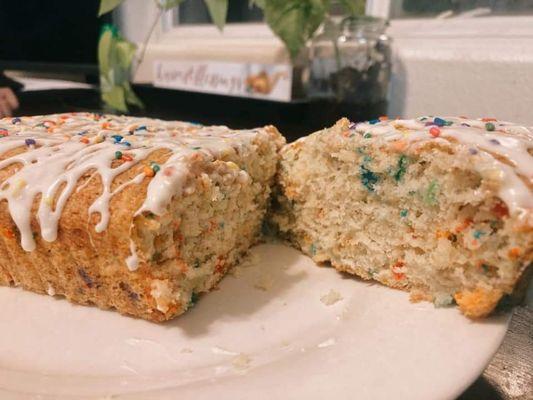 Birthday cake banana bread with vanilla glaze