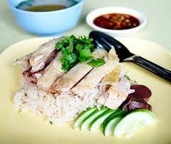 KHAO MUN GAI. Thai Coconut Rice and Steam Chicken Serve with Fermented Soybean Sauce and Chicken Soup