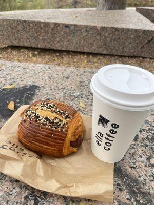 Izzy  Mexican Chile, Dark Chocolate, Double espresso, Oat milk, Cinnamon and Red pepper  Also a sausage croissant.