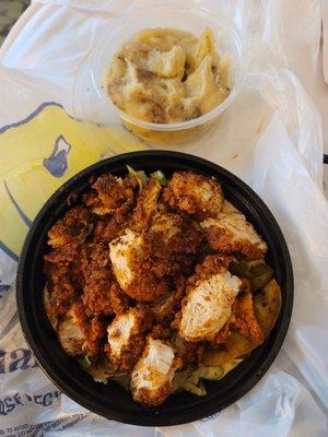 Chicken and rice bowl with side of mashed potatoes