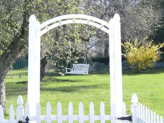 Side yard with apple trees and swing