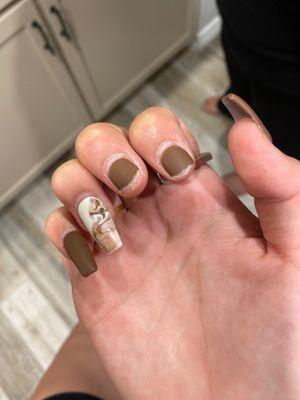 Broken nails and uneven texture on my ring finger from the polish not being fully dried