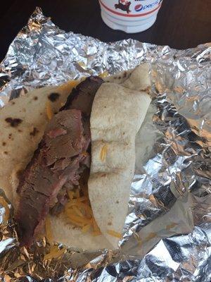 Brisket, potato, and cheese taco