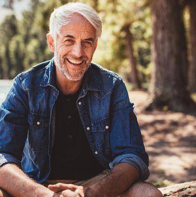 A man enjoying nature after benefiting from therapy.