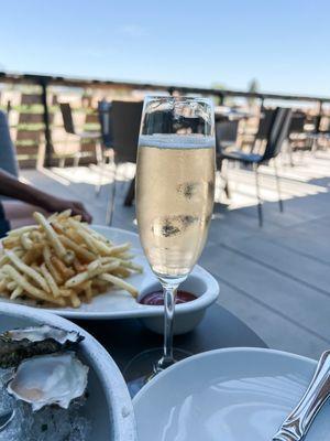 Outdoor space has shaded spot with comfy sofa. Perfect to snack and sip bubbly!