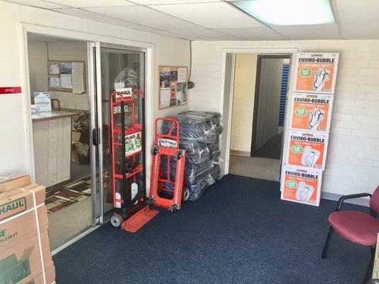 U-Haul boxes, wrap, tape, locks, blankets, and hand trucks