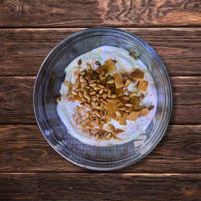 Lebanese Fattit Hummus: pita chips, garbanzo beans, yogurt with tahini, and topped up with roasted pine nuts, cashews, and almonds.