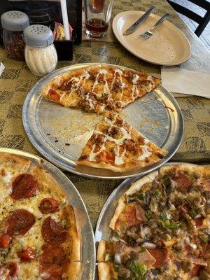 Buffalo chicken at the top Café supreme on the right  Margherita pizza with pepperoni on the left