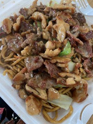 Teriyaki chicken and beef over lo mein noodles.