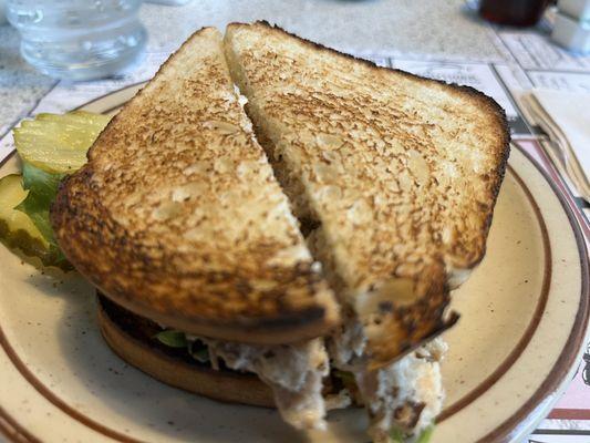 Chicken salad sandwich on white toast made in the restaurant