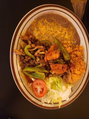 Chicken taco salad,   a combination cheese and beef enchiladas,  combination beef/ chicken fajitas