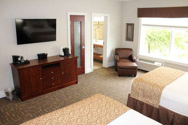 Double Queen Hotel Room at Riverwalk Place Resort & Spa. The TV and view from beds.