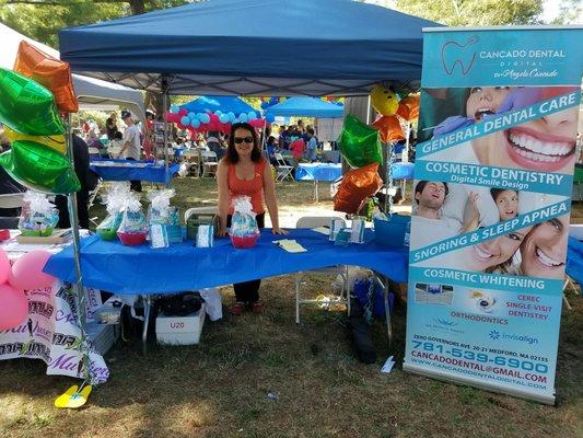 Dr. Cancados at the Brazilian Festival giving out goodies and info.