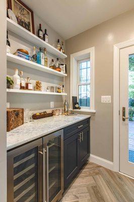 Quartz countertops , hardwood floors in the galley style kitchen