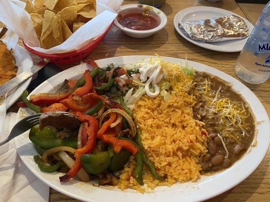 Carne Asada (under the peppers & onions)