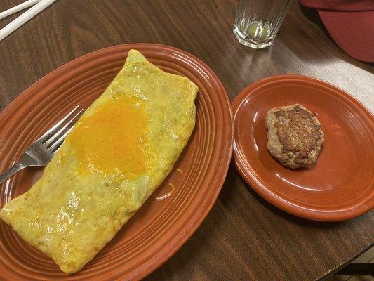 3-egg fluffy omelet made with brown eggs. And sausage patty.