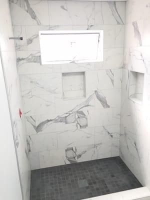 Porcelain tiled shower walls and floor