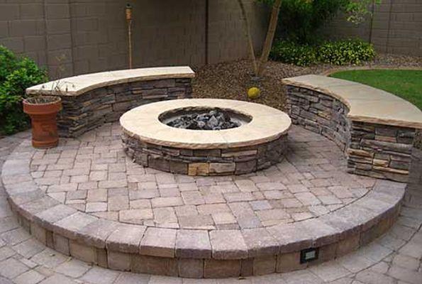 Stone fire pit and built in bench.