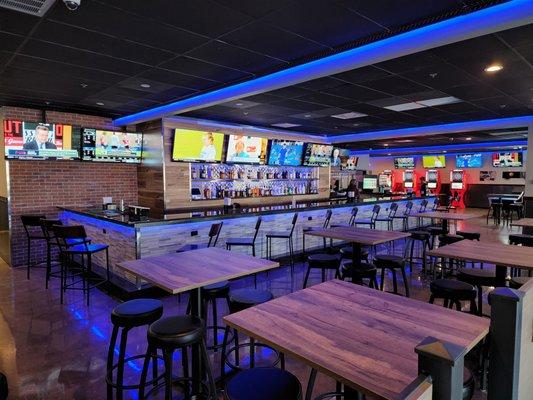 Full size bar with plenty of seating and over 45 TVs.