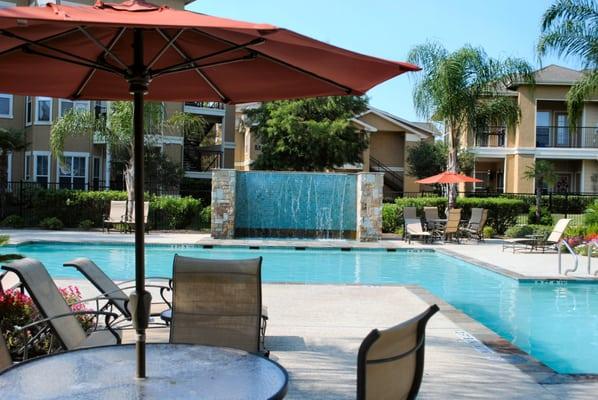 The resort-style pool with waterfall fountain at The Villas at River Park West. Perfect for the hot southeast Texas days!