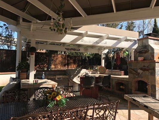 Canvas roof over existing pergola over outdoor bbq kitchen