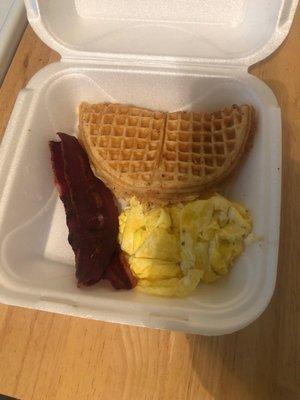 Waffle plate, turkey bacon, we'll-seasoned scrambled eggs.