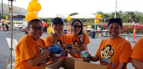 PBC agents Jinnie Yoon, Mark Faildo, Nicole Kehoe and Lani Soliven volunteering at Food Bank food drive.