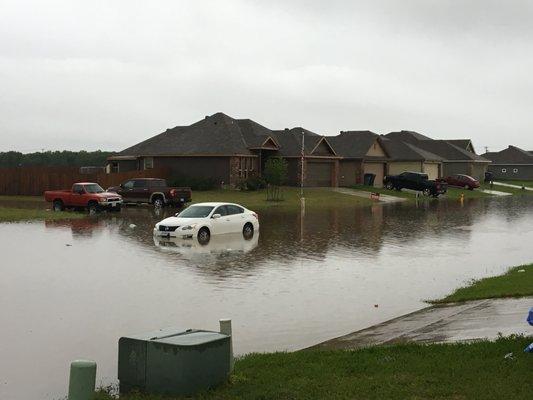 HOA  states we do not have a flooding problem our drive way was built on incline when it rains half way up the drive way