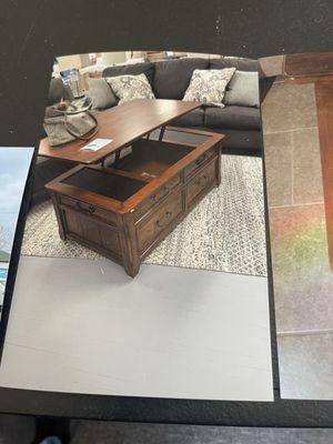 Table on showroom floor saying wouldn't deliver my wife's purse on it with markings to show it's the same table