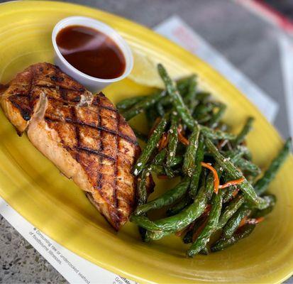 BBQ Salmon with double side of green beans with sauce on the side.