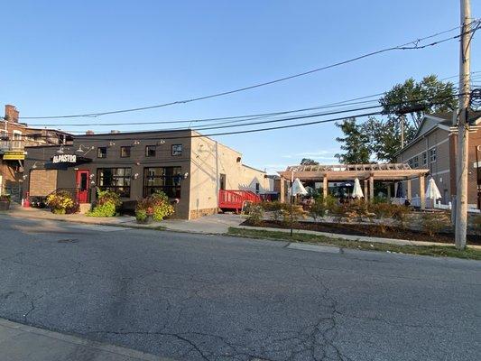 The area on the right, the outdoor patio, has a grass section.