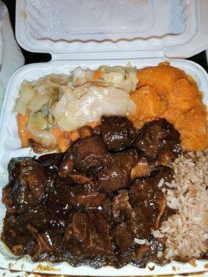 Large oxtail w/ candied yams, mixed cabbage and rice & peas (takeout) sooo delish!