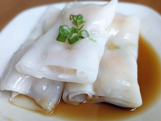 Cheung Fun mainly thick rice paper with minimal shrimp cut in half.