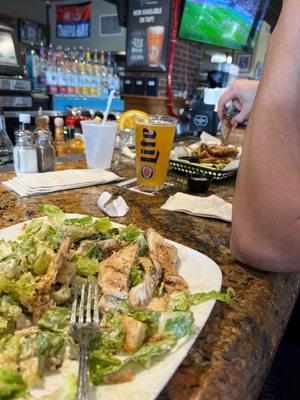 Caesar salad and Jamaican jerk wings