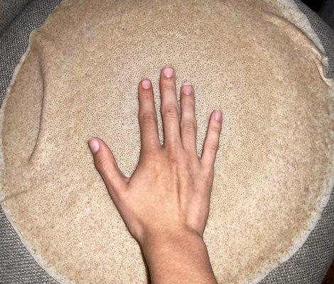 Hand relative to injera...it's huge