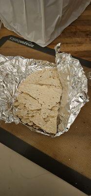 Single piece of (crushed) papadum. No sauces.