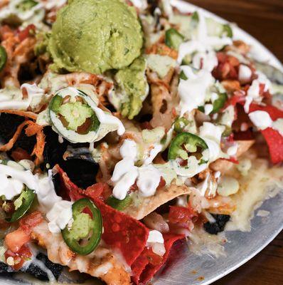 loaded nacho platter with guac