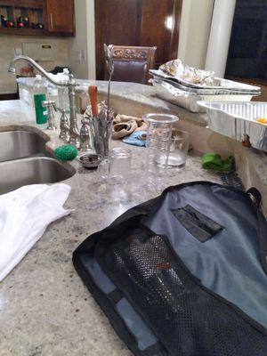 Kitchen island after chef left leaving behind personal belongings.