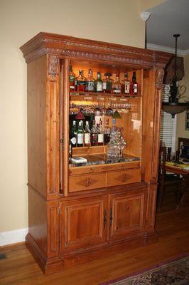 Repurpose an entertainment center into a bar, or home office desk or kitchen cabinet.