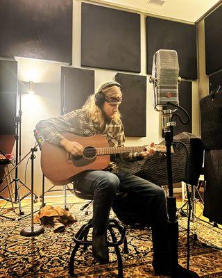 Acoustic guitarist  tracking at Post Pro with the AEA R44 active ribbon microphone.