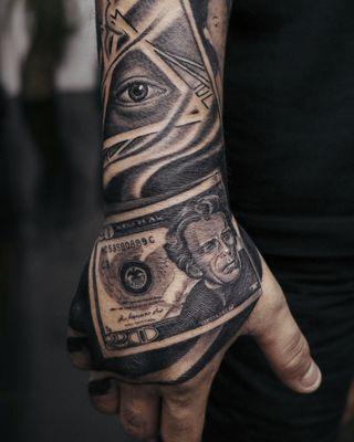 Black & grey money hand tattoo