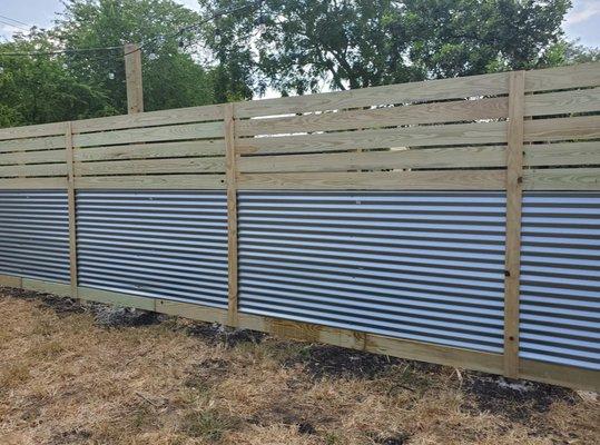 Mixed material fences are popular alternatives to standard wood fences.