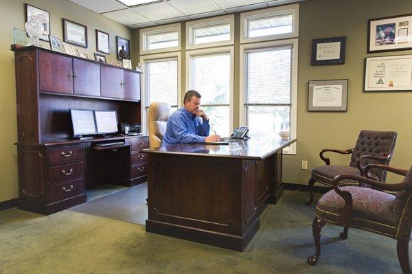 Greg hard at work in his Hamilton office.