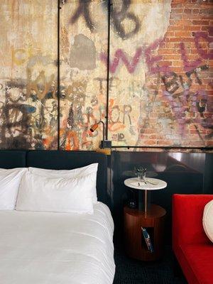 Original graffiti wall was maintained in this corner suite!