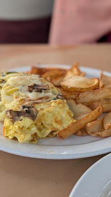 Omelette with mushrooms, onions, and jalapeños