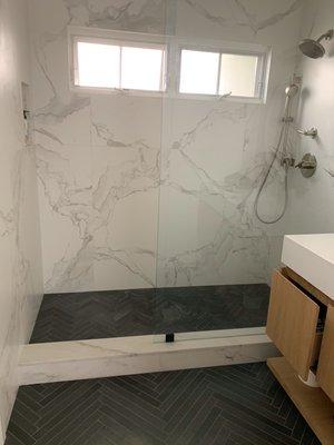 Porcelain and stone walk-in shower.