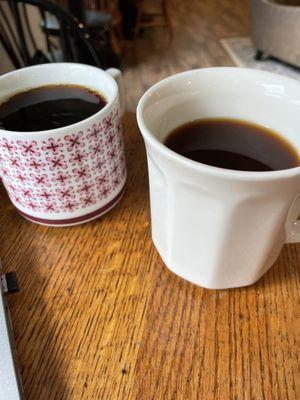 Decaf Americano in the tall cup. And drip black coffee in the other cup.