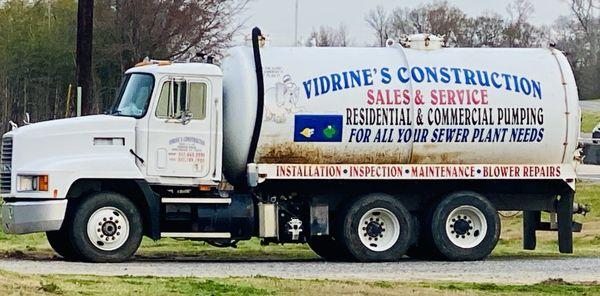 Vidrine's Construction pump truck advertisement for commercial and residential systems.