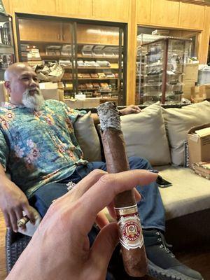 Arturo Fuente - and boxes on the outdoor lawn chair.