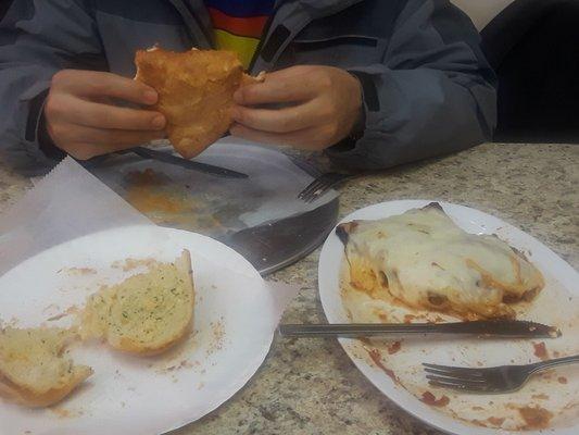 Meat calzone. Eggplant parmesan and garlic bread. Very delicious.